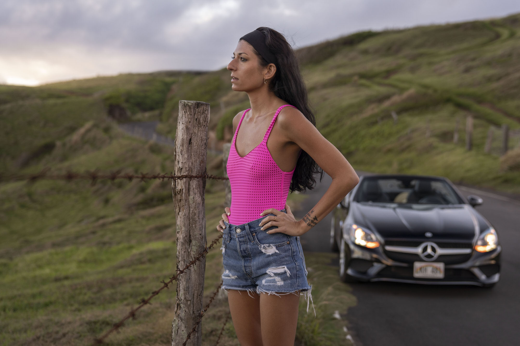 Chelsea Zerjav standing beside Mercedes-Benz SLC 300 in Maui, Hawaii