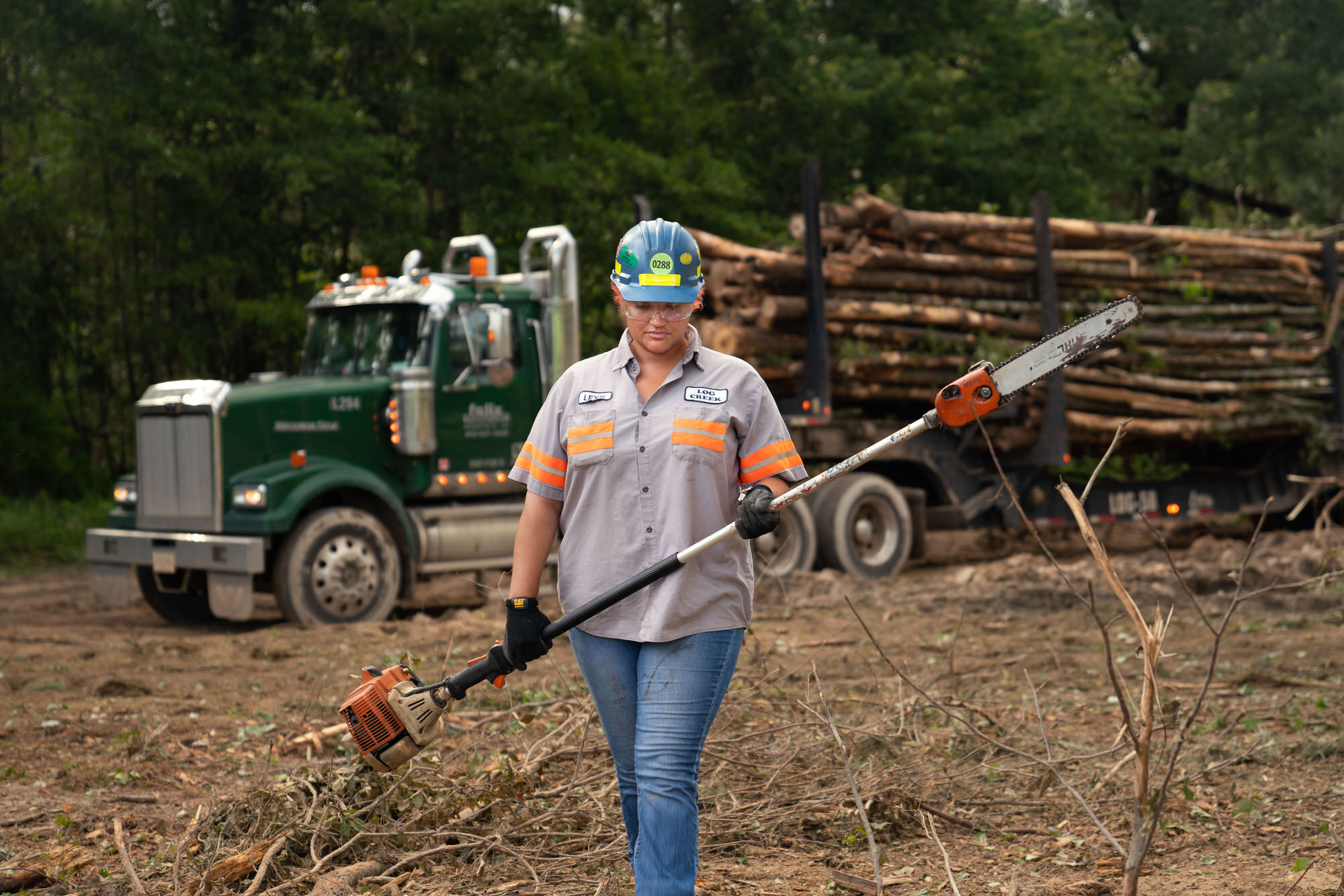 Female Trucker Cutting Wood for Swiss Krono in Barnwell, SC