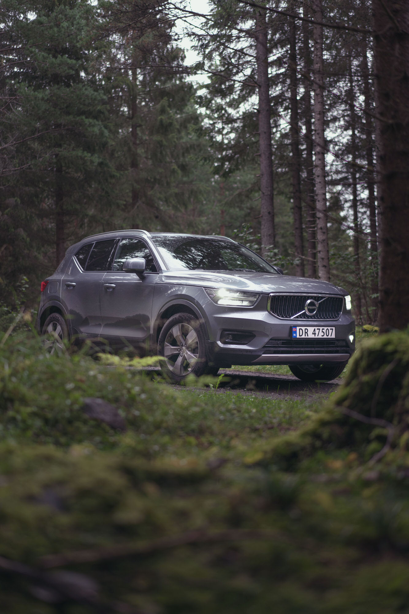 Silver Volvo XC40 in the deep forest of Hamar, Norway